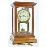 A Gustav Becker Anniversary clock with 7cm enamel dial, in glazed mahogany case,