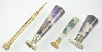 Two seals with Blue John mounts, a moss agate mounted seal and an agate mounted pencil,