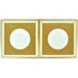 A pair of Royal Copenhagen bisque wall plaques, impressed fasctory marks, later framed,