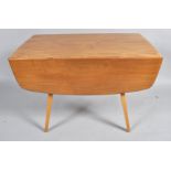 An Ercol style drop leaf table with elm top and splayed legs, 71cm high,