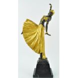 After Chiparus, a bronze figure if a dancing girl, her clothes gold painted on a black marble base,