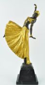 After Chiparus, a bronze figure if a dancing girl, her clothes gold painted on a black marble base,