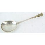 A white metal Apostle spoon with gilt figure terminal, possibly St Thomas,