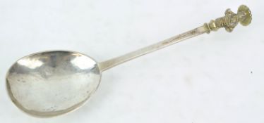 A white metal Apostle spoon with gilt figure terminal, possibly St Thomas,