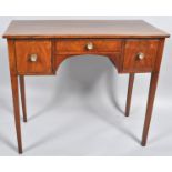 An early 19th century mahogany veneered three drawer sideboard, of small proportions,