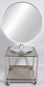 Durlston Design Ltd - A 1970's retro vintage round mirror on stand along with a Howard Miller two