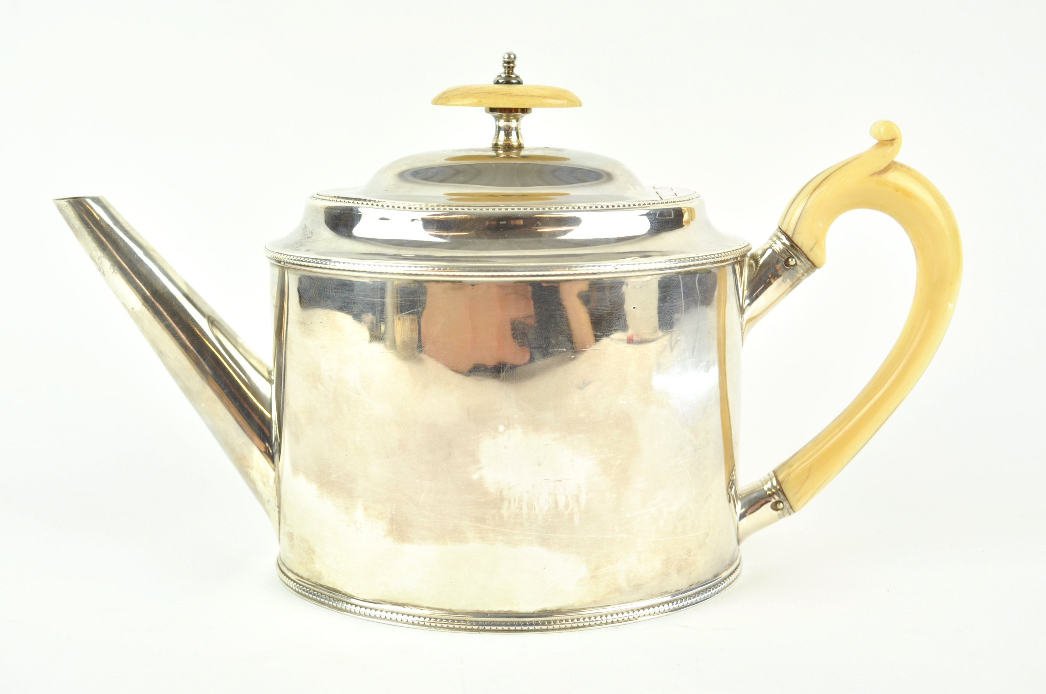 A George III silver tea pot, of plain oval bead edge form, with domed cover, Ivory knop and handle, - Image 4 of 5