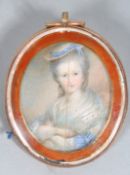 A 19th century oval miniature portrait of a Lady, seated wearing a hat, shawl and laced dress,