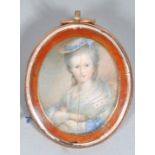 A 19th century oval miniature portrait of a Lady, seated wearing a hat, shawl and laced dress,