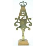 A 19th century West Country Friendly brass stave head, Dowlish Wake, Somerset, on later oak plinth,