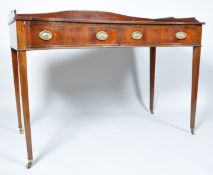 A 19th century mahogany sideboard with raised shaped back above two inverted frieze drawers on