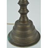 A brass lamp of angular baluster form, overall 61.