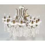 An antique style twelve branch cut glass chandelier with droplets,