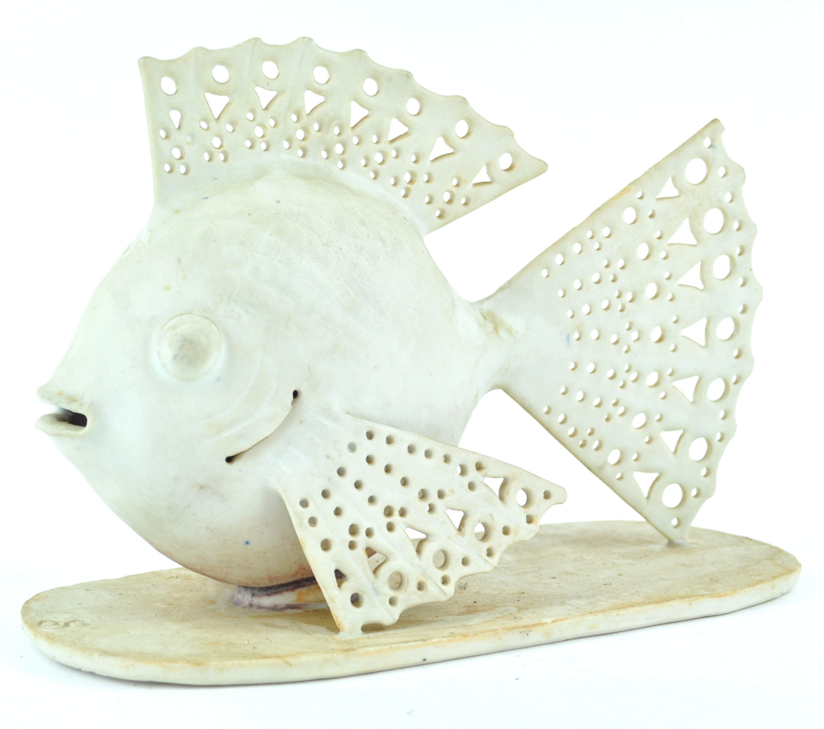 A Studio pottery figure of a fish with pierced tail and fins, incised potters mark,