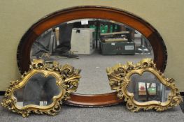 Two gilt and an oval wood framed mirror, the wooden one