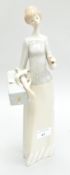 A Lladro figure of a lady with a parasol, 34cm high,
