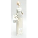 A Lladro figure of a lady with a parasol, 34cm high,