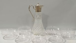 A claret jug with silver plated mounts,