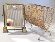 A brass swing mirror and a metal gold painted 'wicker style' magazine rack,