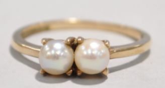 A gold and pearl ring