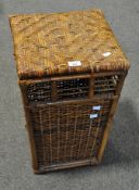 A wicker laundry basket and cover, of tapering square section,