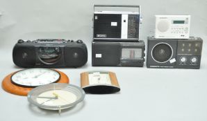 A group of assorted clocks, A Sony cassette player,