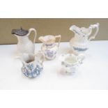 A collection of five 19th century jugs and ewers, having sprigged decoration,