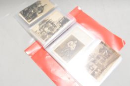 A collection of fifty four assorted WWI First Word War related postcards and pictures