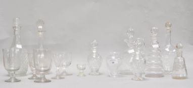 Five glass decanters, including a pair of cut glass bottles and stoppers,