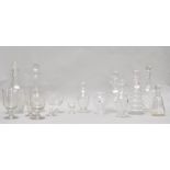 Five glass decanters, including a pair of cut glass bottles and stoppers,