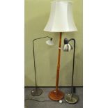 A collection of three standard lamps, to include a brass lamp, teak lamp and another,