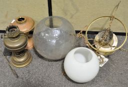 A group of various oil lamps and glass shades (1 box)