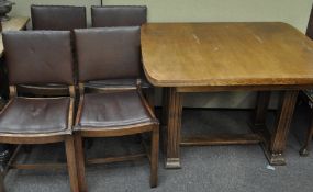 A 1930's Art Deco oak dining suite, comprising four chairs and an extending table,