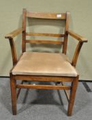 A set of four chairs and an oak elbow chair