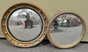A convex mirror and two other mirrors