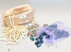 A collection of assorted costume jewellery to include glass beads,