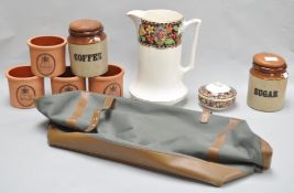 A selection of terracotta food canisters and other items