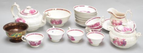 A part tea service of Sunderland lustre, comprising a teapot, seven cups, ten saucers, a plate,