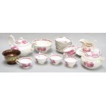 A part tea service of Sunderland lustre, comprising a teapot, seven cups, ten saucers, a plate,