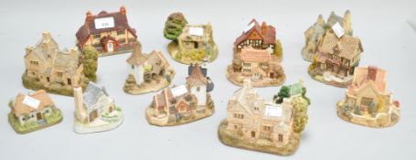 A collection of sixteen model houses, mostly Lilliput Lane and others,