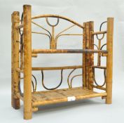 An early 20th century bamboo folding display shelving system,