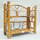 An early 20th century bamboo folding display shelving system,