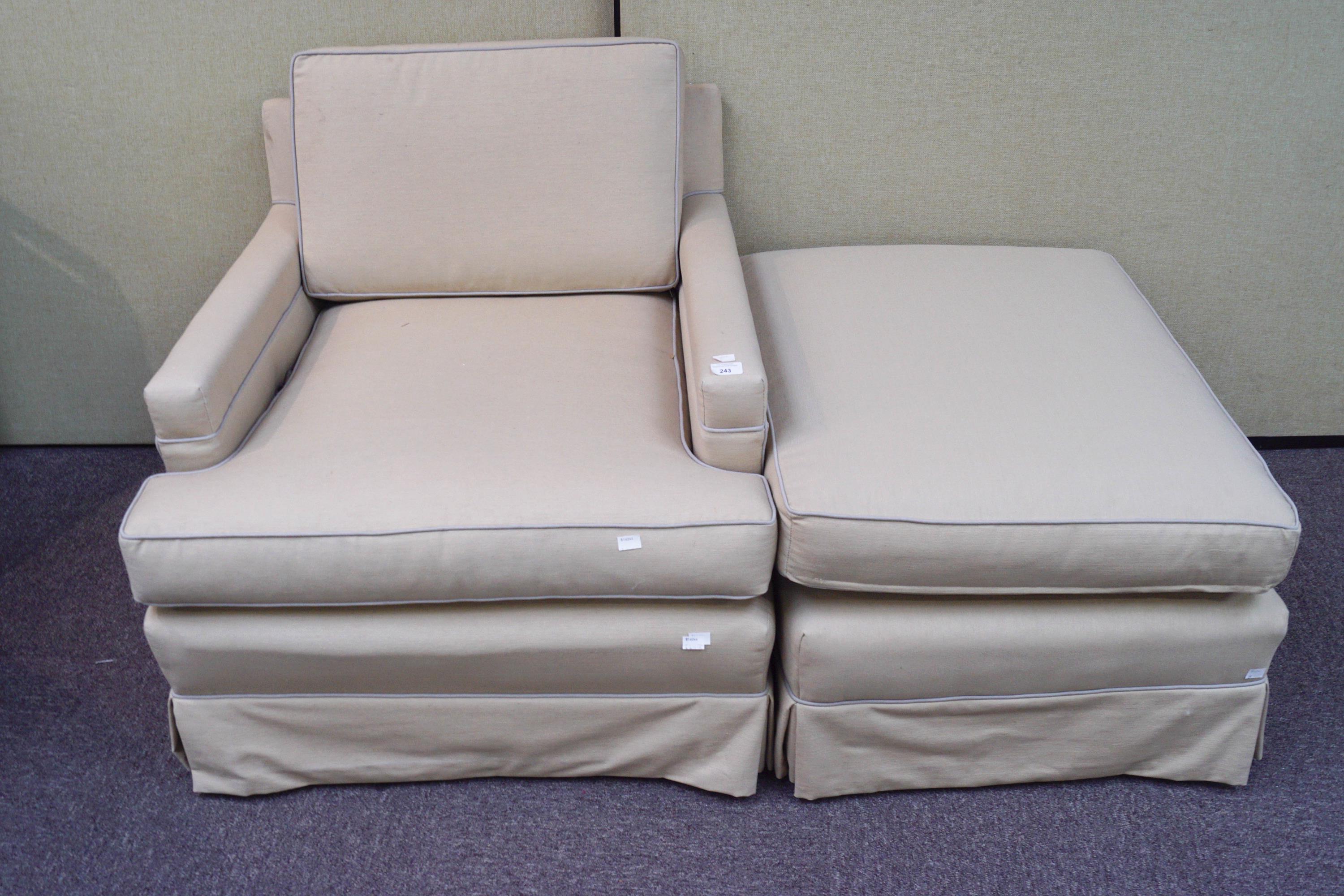 A modern armchair and matching footstool, upholstered in beige linen, armchair 77cm x 75cm,