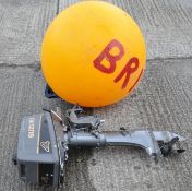 An Suzuki 4 petrol outboard motor and a buoy