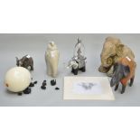 A collection of elephant related items, to include a lidded pot, a bronzed resin figure,