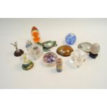 A quantity of glass and other paperweights with other items