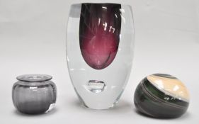 A collection of three Studio art glass items, to include a paperweight,