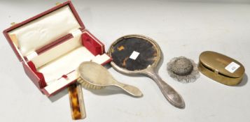A boxed silver brush and mirror and other items