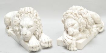 Two composite figures of recumbent lions,