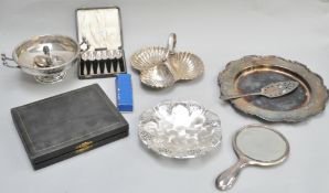 A silver hand mirror,